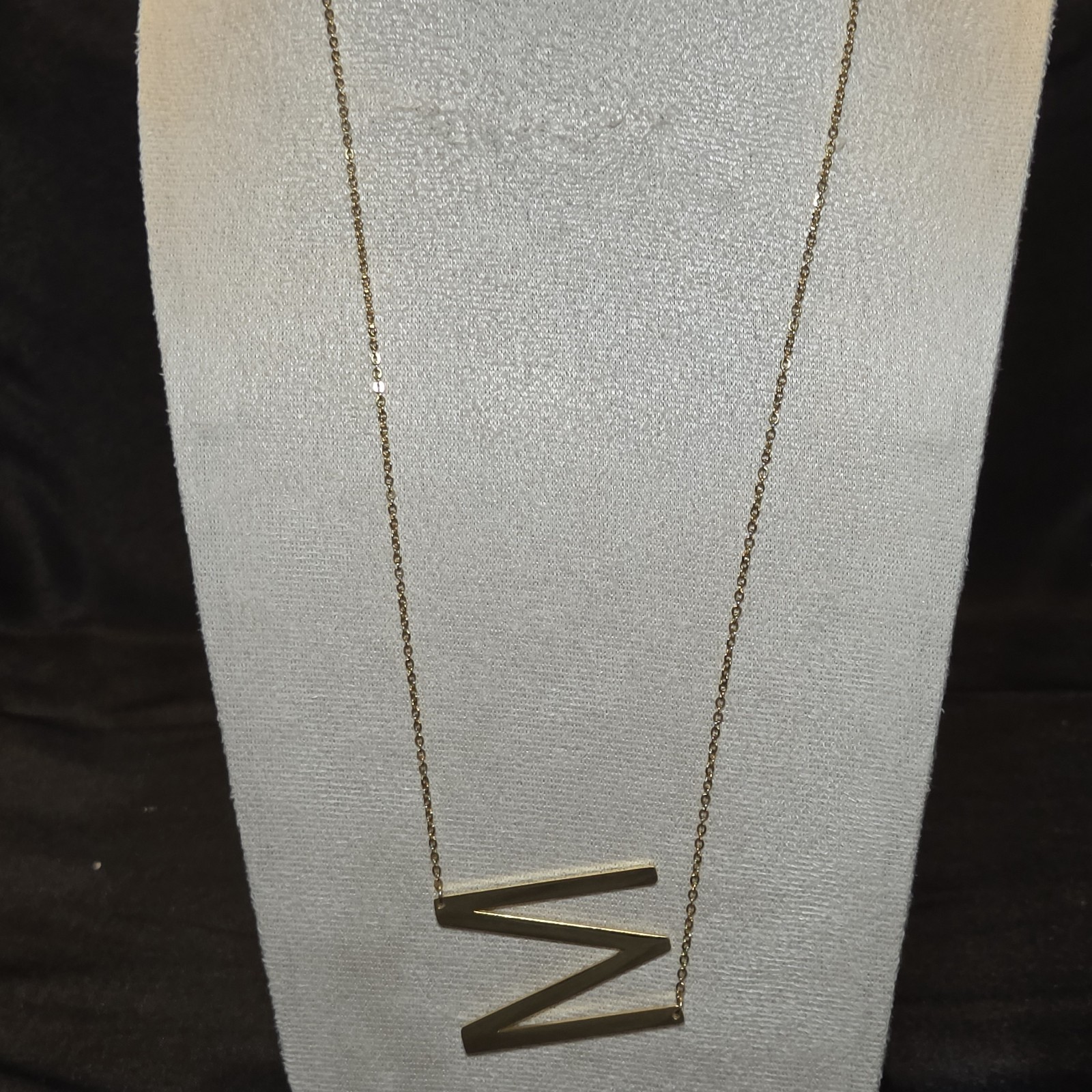 Gold-tone Geometric Zigzag Pendant Necklace With A Sleek Modern Design