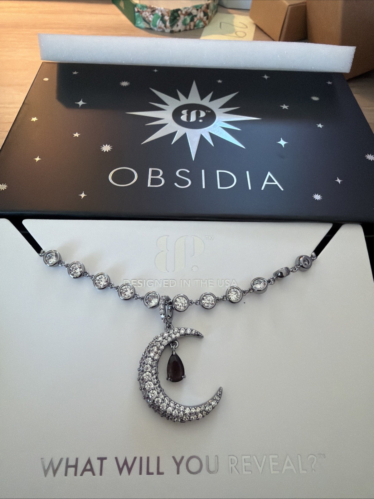 BOMB PARTY OBSIDIA ULTRA RARE UNICORN BELLA’S LUXE MOON NECKLACE ON HEMATITE
